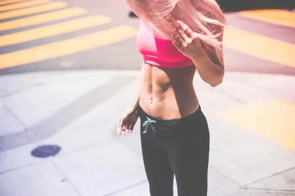 Woman with toned stomach after LA-EMS Body Sculpting Treatment Watford